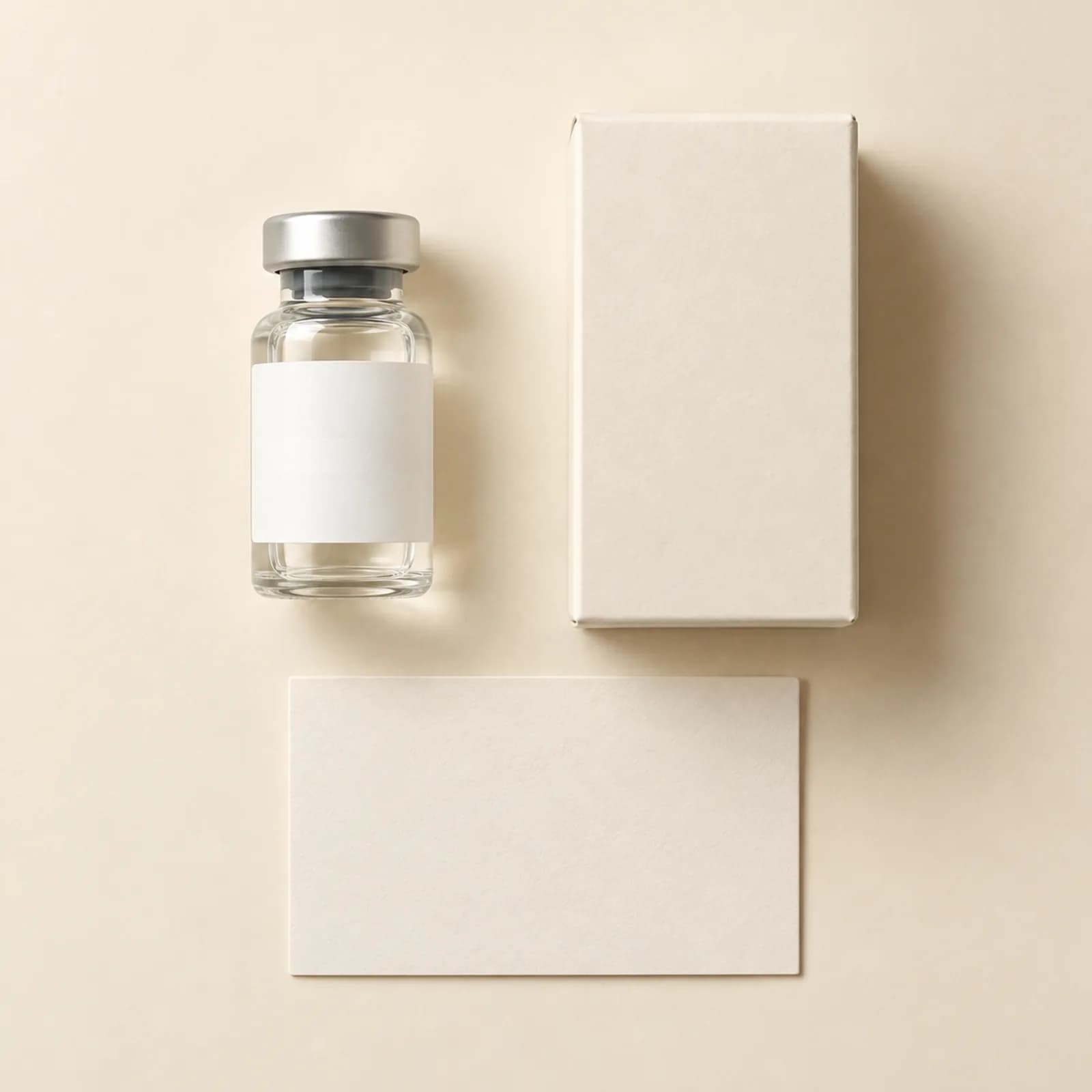Illustrative medication vial beside a plain box and instruction card